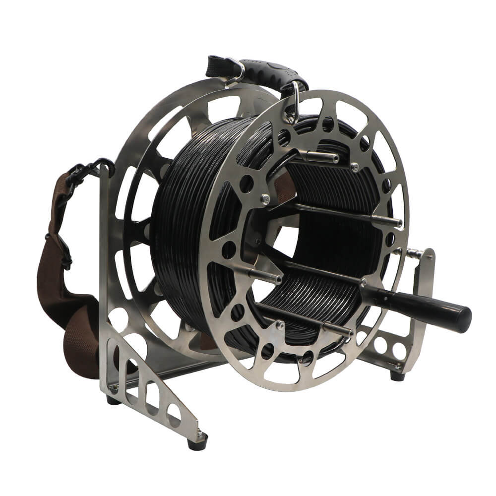 Portable subsea cable winch on ground-stand base with top carry handle and skeletonized lightweight drum